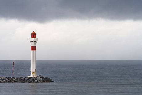 Lighthouse of Cannes under a cloudy sky photo