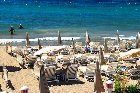 Tourists on the beach of Cannes French Riviera photo